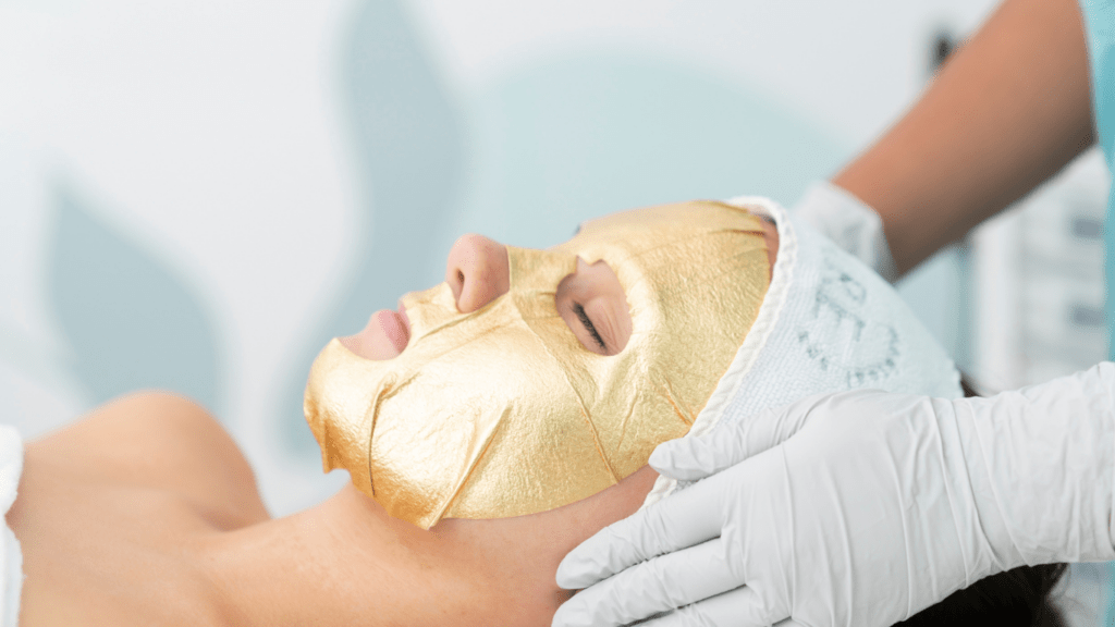 Woman with gold facial mask