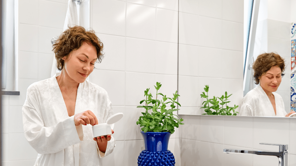 Middle aged woman using anti-aging cream