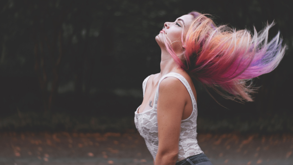 Woman flip her colored hair